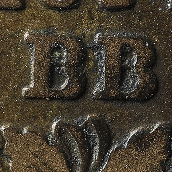 Gros plan sur les lettres BB d'un décime frappé à Strasbourg en 1814